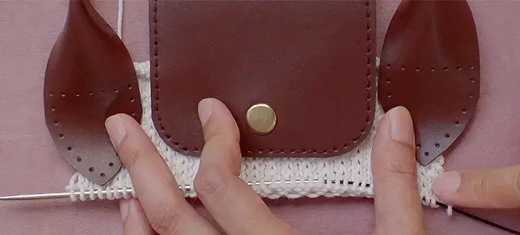 The number of cast on stitches will depend on the length of your leather flap and handles