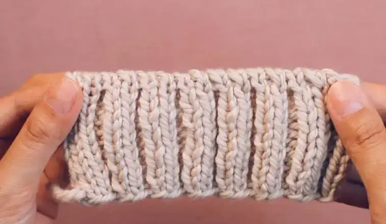 a knit swatch showing 2x2 rib 